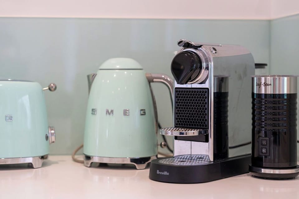 Coffee machine and milk frother