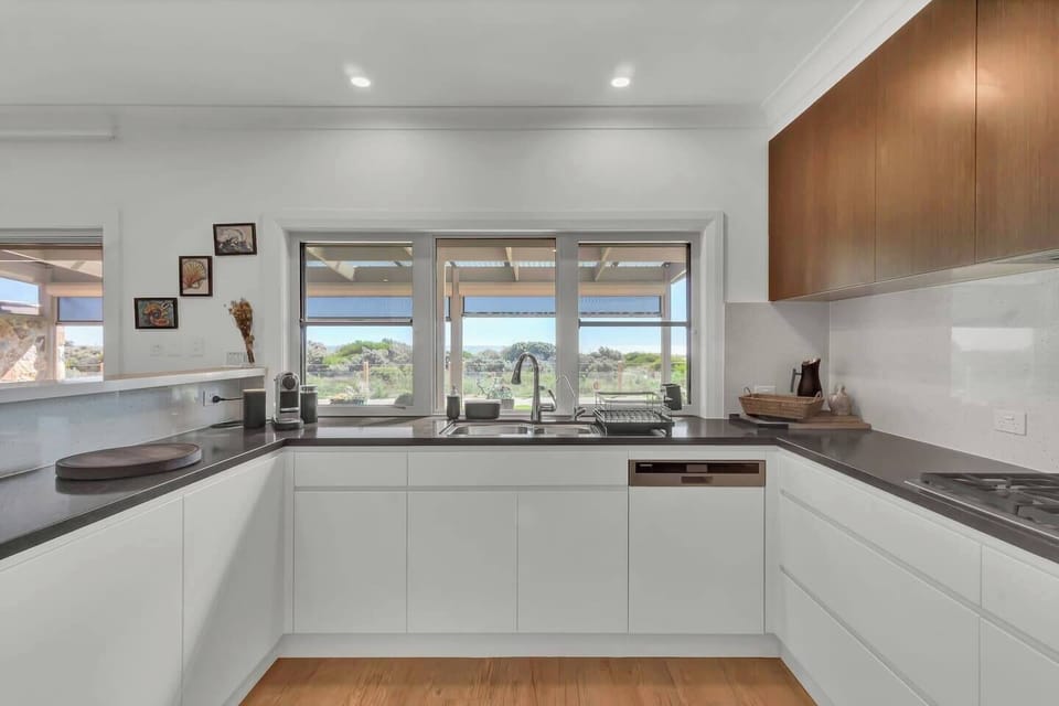 The modern, well-appointed kitchen has everything that’s needed to cook up a delicious feast, plus a dishwasher for easy clean-up. 
