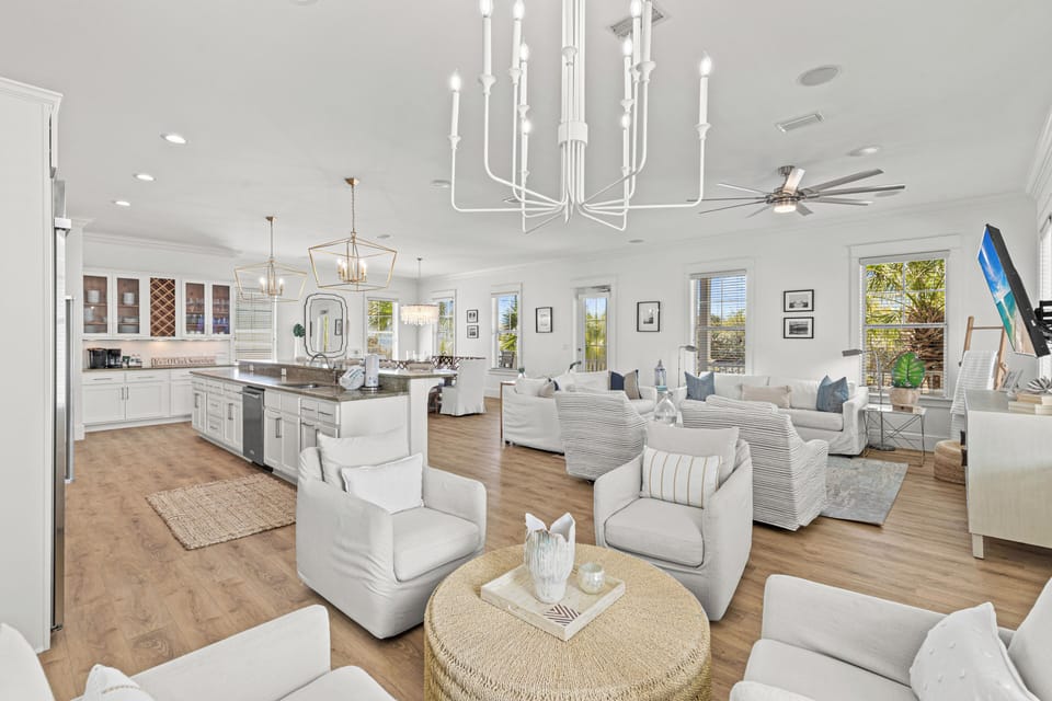 Relax in your bright, open-concept living space where plush seating and natural light create the perfect atmosphere for unwinding together.