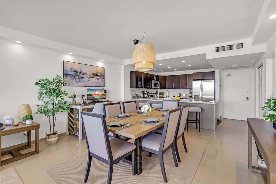 Dine in style 🍽️ Elegant dining and kitchen space with cozy lighting and beachy vibes. 