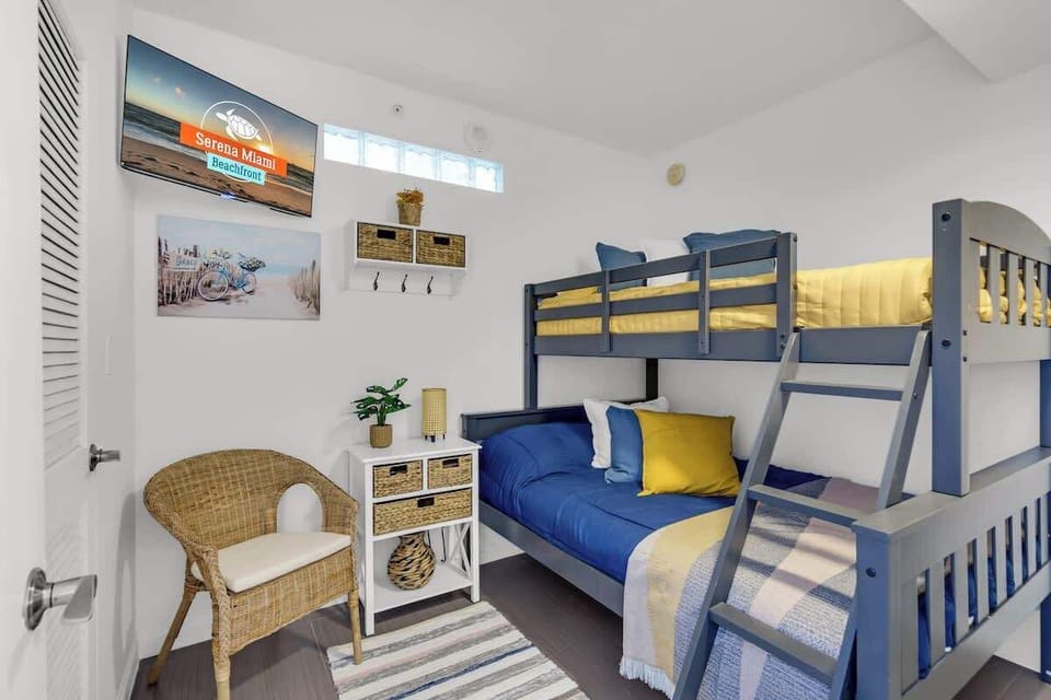 “Cozy bunk room near Surfside Beach! Perfect for families with comfy bedding, beachy decor, and natural light.”
