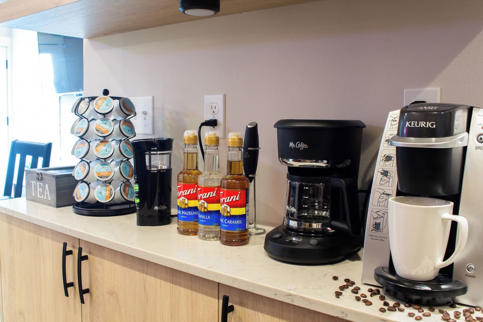 Caffeine lover's dream: Keurig, coffee, tea, syrups.