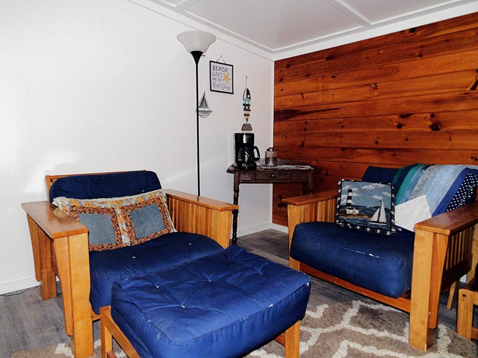 Second bedroom with seating area and additional coffee pot.
