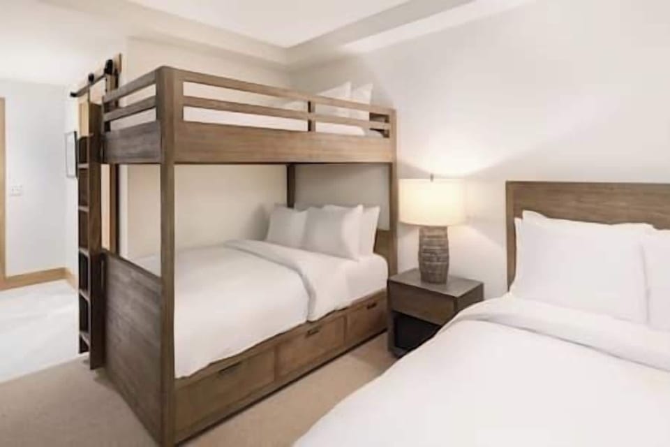 Settle in together with cozy bunks and crisp linens.