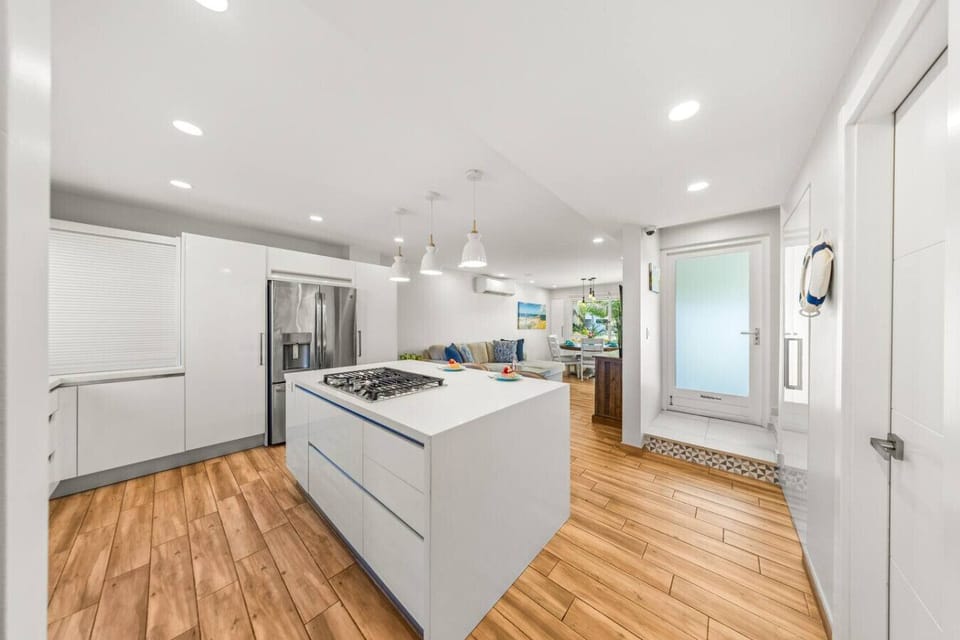 Kitchen with a sleek island, gas cooktop, and open layout for easy entertaining.