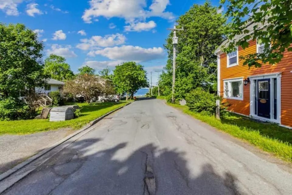 Strolling down this quiet street feels like stepping into a tranquil oasis, where the hustle and bustle of the world fade away, leaving only the gentle whispers of leaves in the breeze and the distant hum of life #Carbonear
