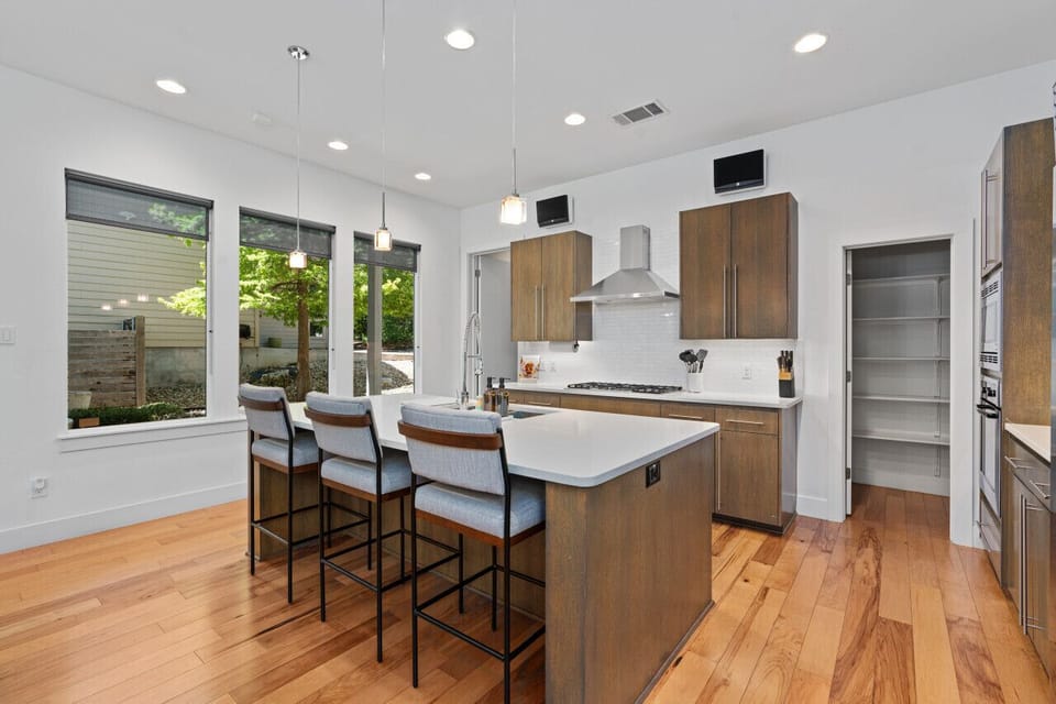 Gather around the sleek kitchen island for cooking and conversation.