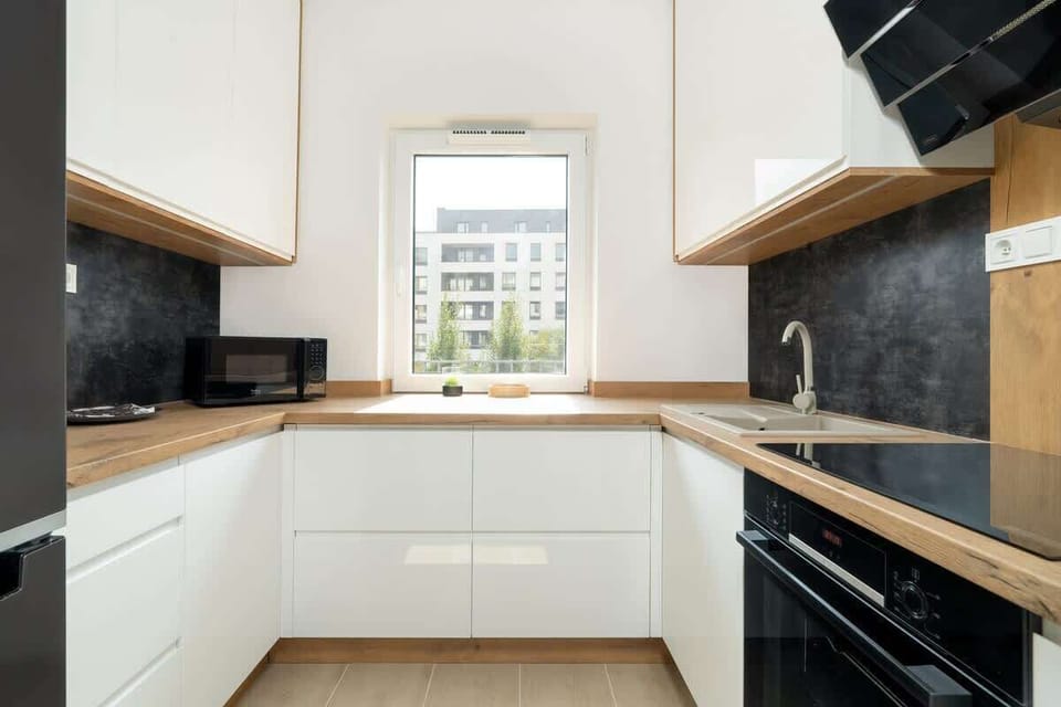 Separate kitchen with microwave.