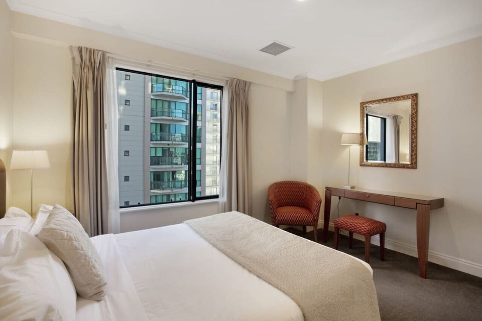 There is a handy chair and table in the room for your personal items.