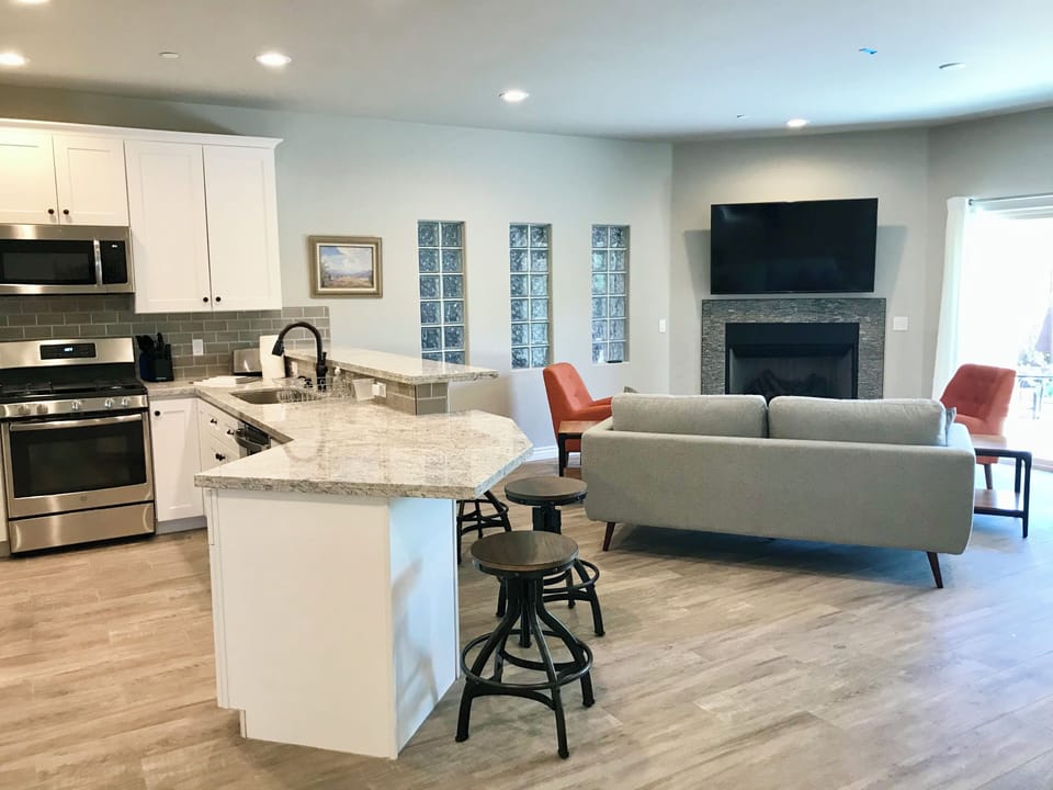 Kitchen open to great room with gas fireplace