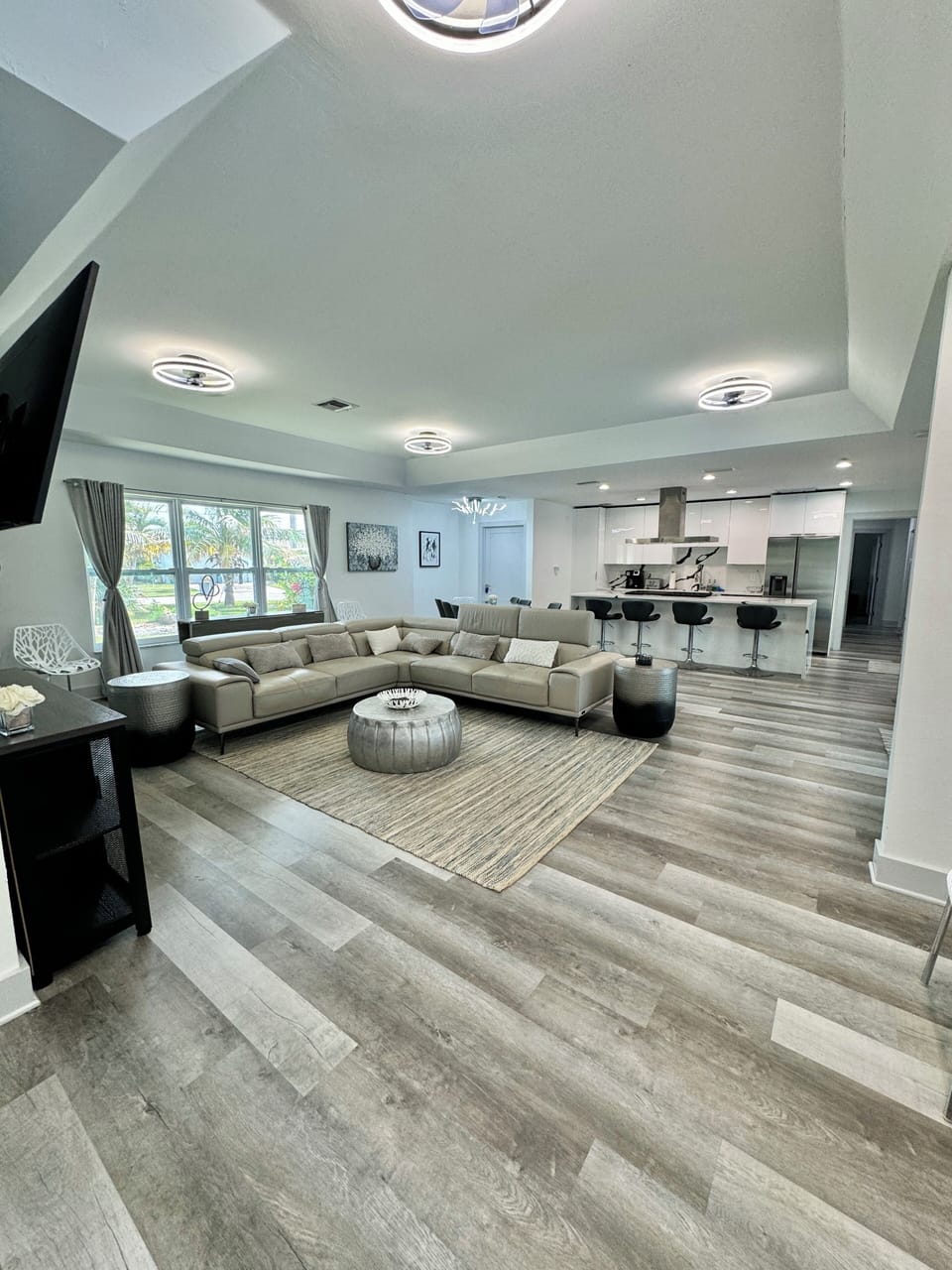 Living room, dining room and kitchen area.   Open concept.