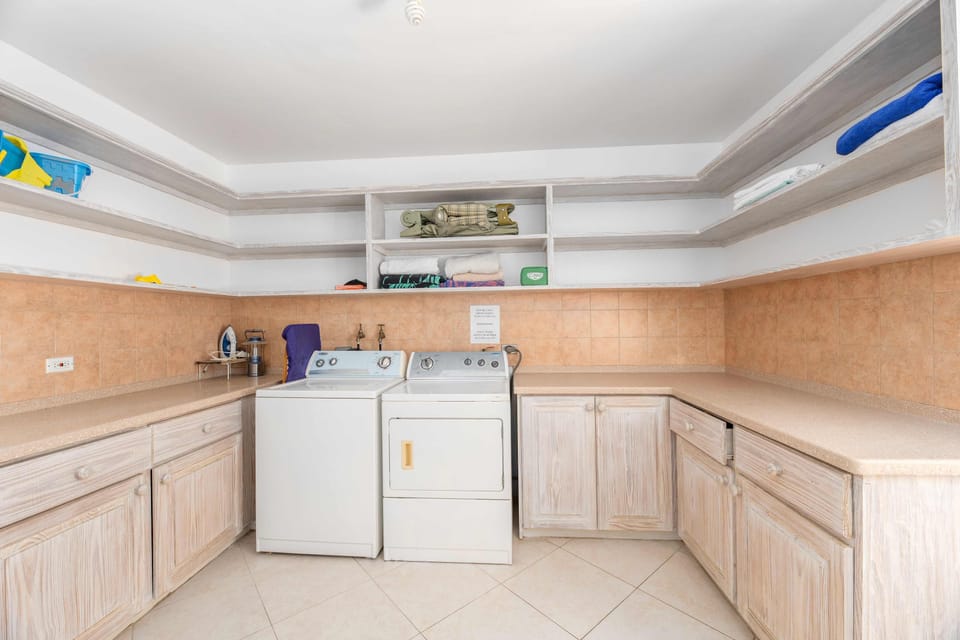 full laundry room spaare linen, sink lots of space