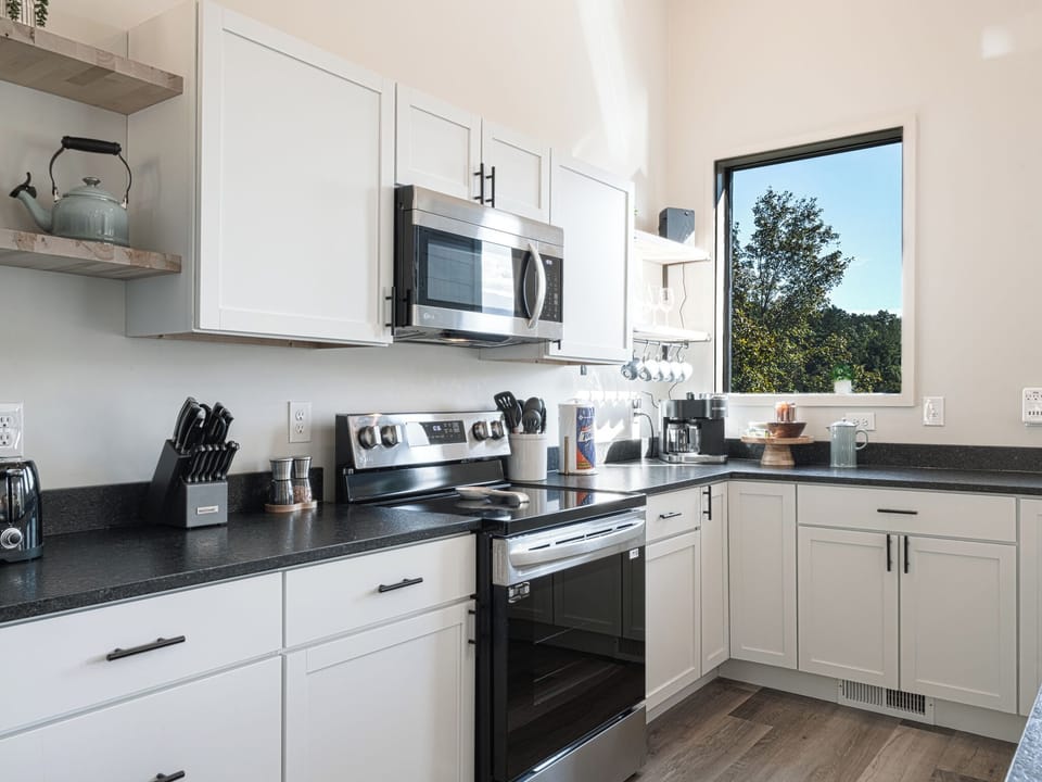 This isn’t your average rental kitchen. Expect clean lines, full spice racks, luxe dish + hand soaps, paper goods, and everything prepped for memory-making meals.
