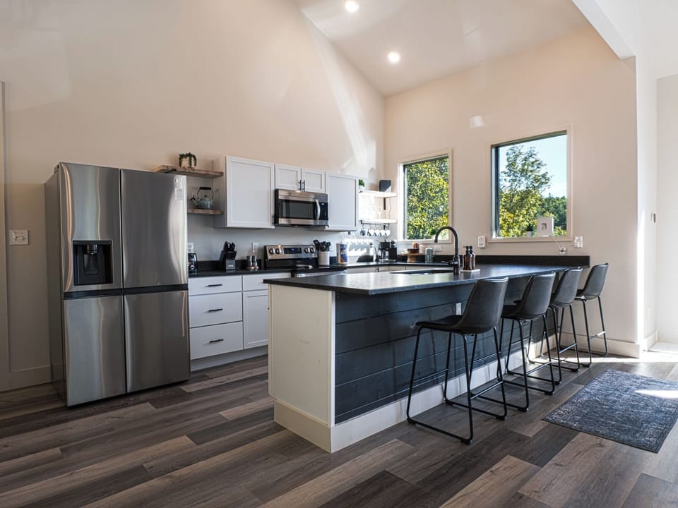 This kitchen pairs sleek design with everyday ease—featuring stainless steel appliances, modern fixtures, and everything you need to gather, cook, and connect.