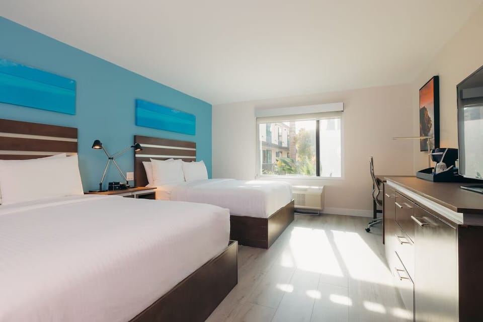 Wake up in a sunlit double-queen room made for friends.