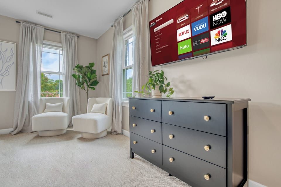 43in Smart TV on top of dresser in Primary bedroom. 