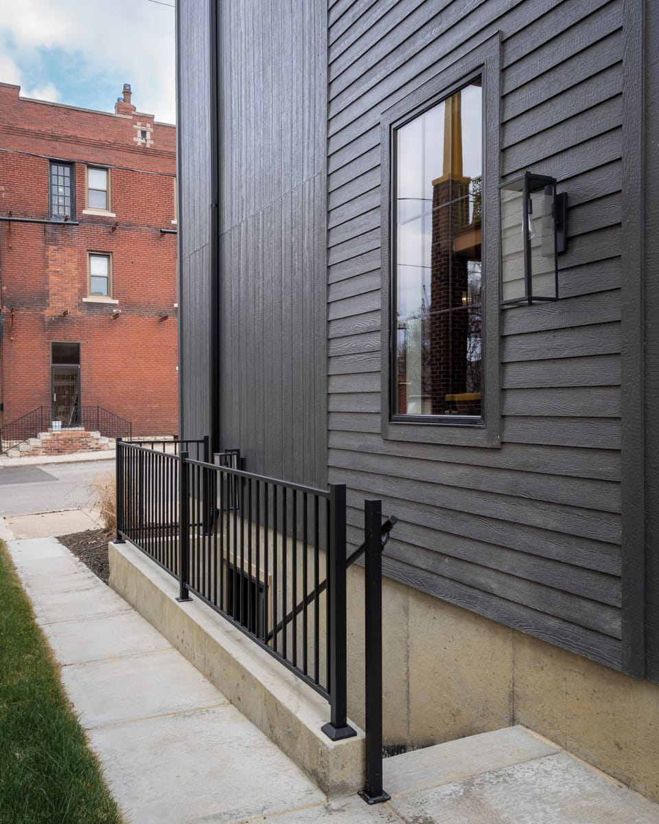 Private exterior entrance to The Traveler, tucked into a modern new-build in the heart of Columbus Park.