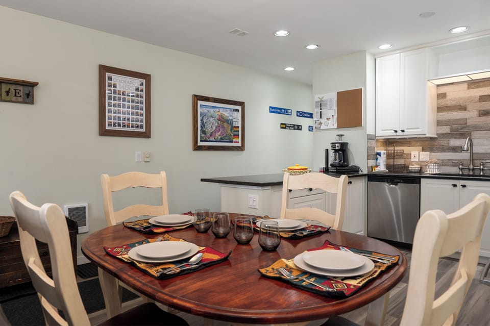 Gather around this inviting dining table where your meals become memories, with a fully-equipped kitchen ready for your culinary adventures.