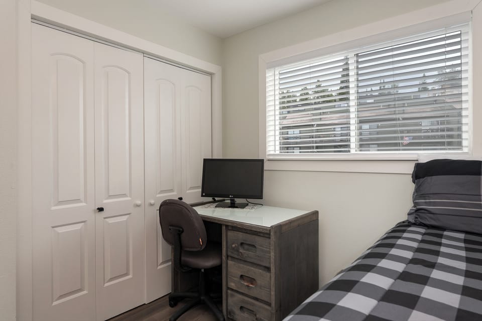 Your private workspace features a dedicated desk and comfortable seating, perfect for catching up on work between adventures.