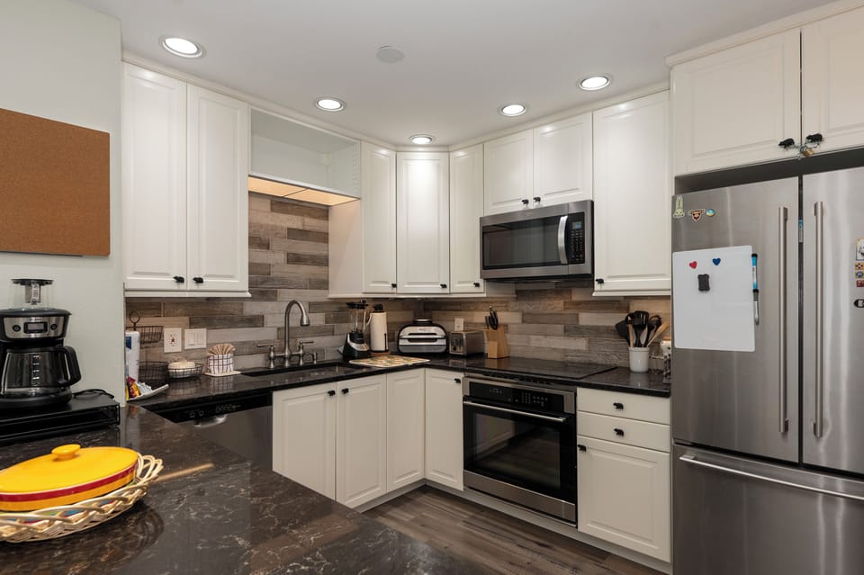Your fully equipped kitchen invites culinary adventures with granite countertops, stainless steel appliances, and everything needed for memorable meals.