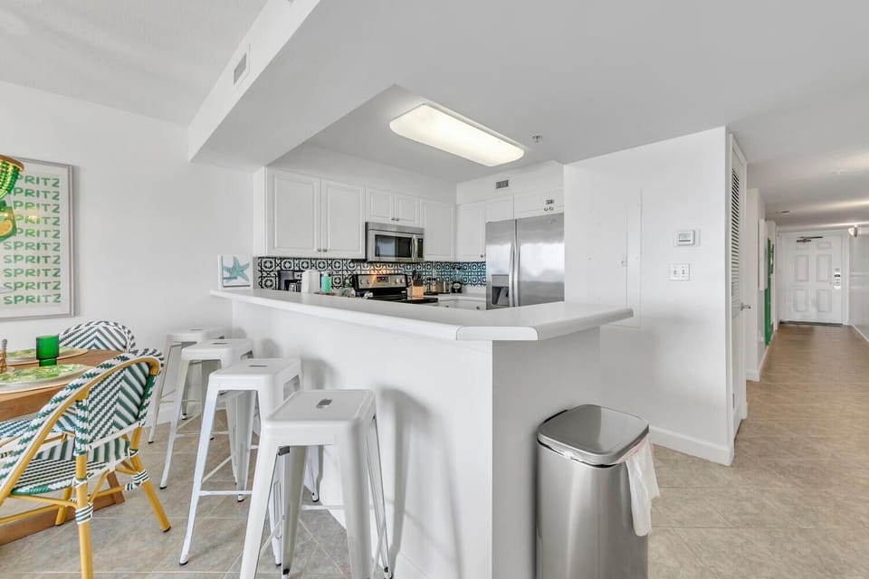 Your modern kitchen features stainless steel appliances and a spacious breakfast bar where you can start mornings with fresh coffee.