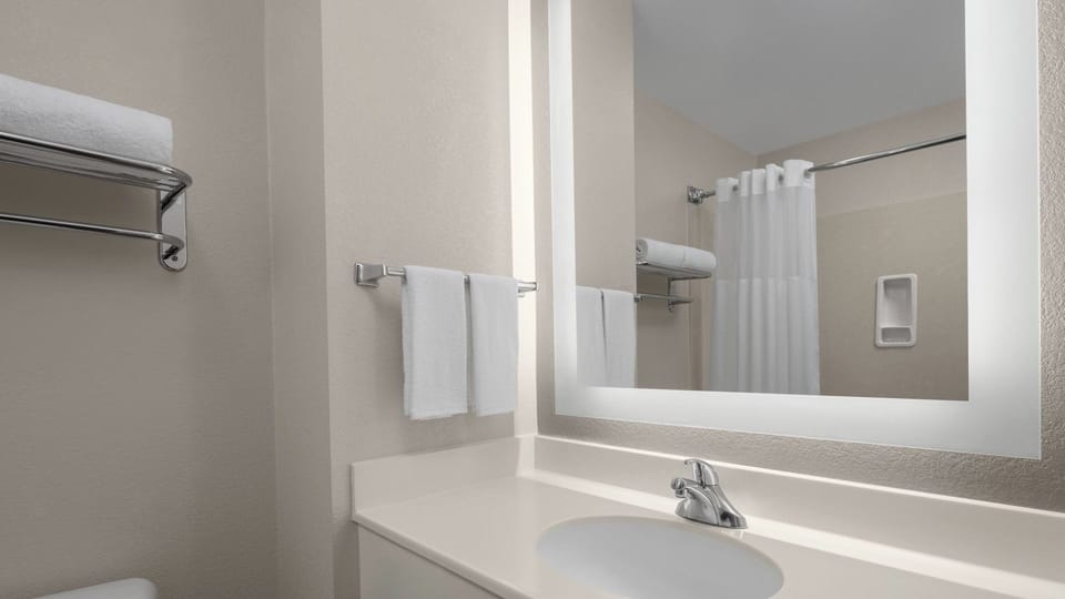 Refresh your morning routine with a bright vanity and fresh towels.