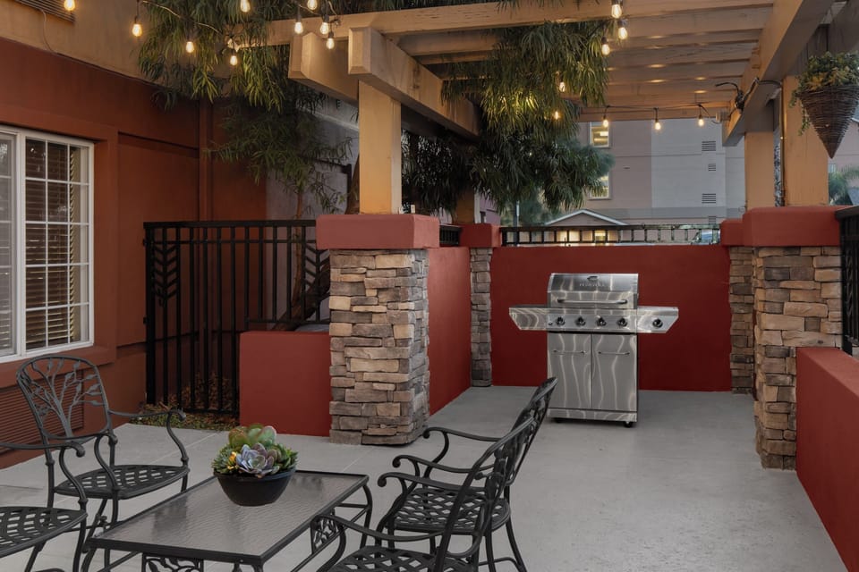 Gather under café lights for relaxed grilling and conversation.