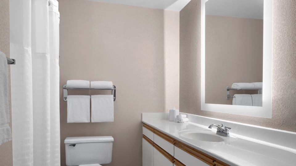 Refresh easily in a spotless bath with bright mirror lighting.