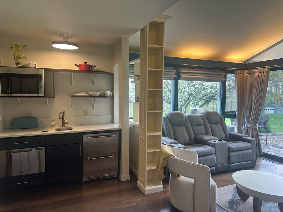 Private suite with gorgeous custom kitchen and kick back cinema type loungers 