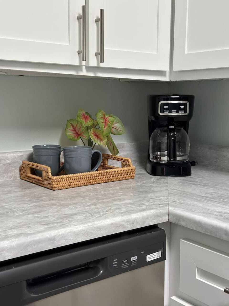 Coffee maker and beautiful cups for sipping your coffee.