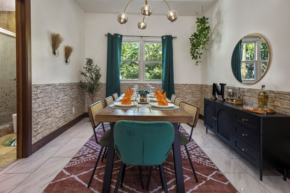 A bathroom is next to the dining area