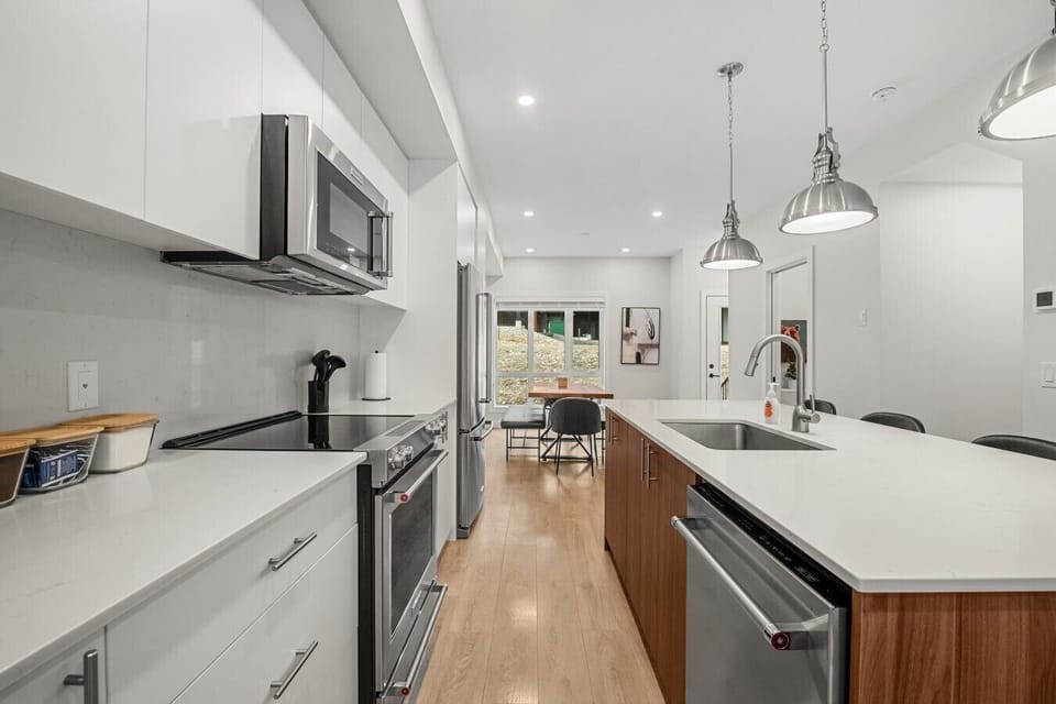 Full kitchen with a blender, griddle, slow cooker, drip coffee machine, ground coffee, tea, sugar and basic condiments (ketchup, mustard and relish.)