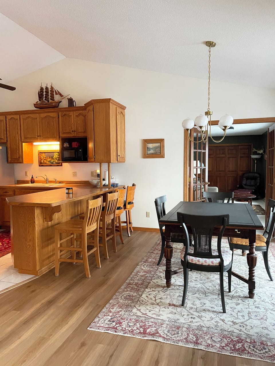 Dining table grows to sit 6 people. Card table and 6 extra chairs provided.

