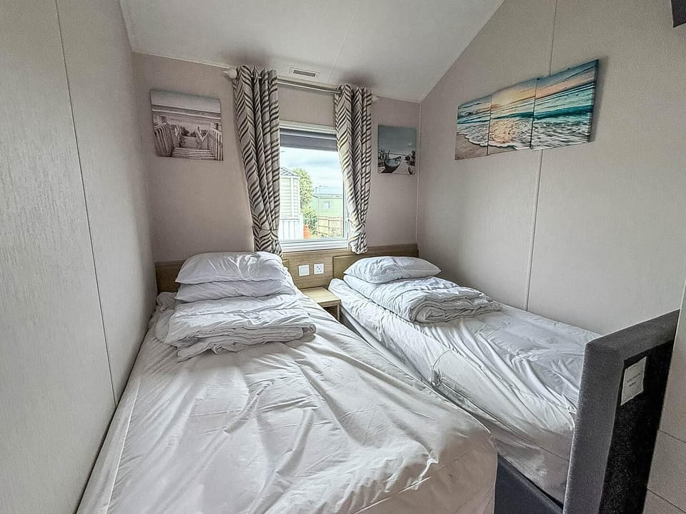 You’ll find comfortable twin single beds, creating a dedicated space for children to relax and recharge after a day of adventure.