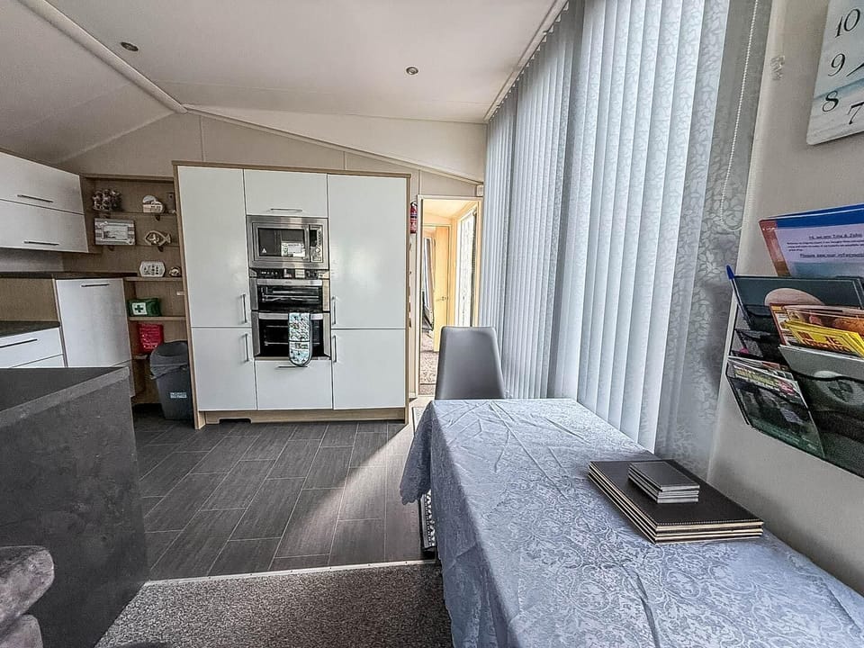 The open-plan layout ensures there is plenty of room for everyone to unwind comfortably, even after an exciting trip to the nearby dog-friendly beach.