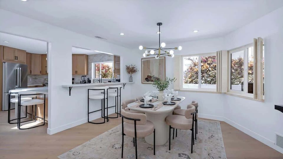 Gather for a meal at the stylish dining table, or keep it casual with breakfast at the bar-height kitchen counter.