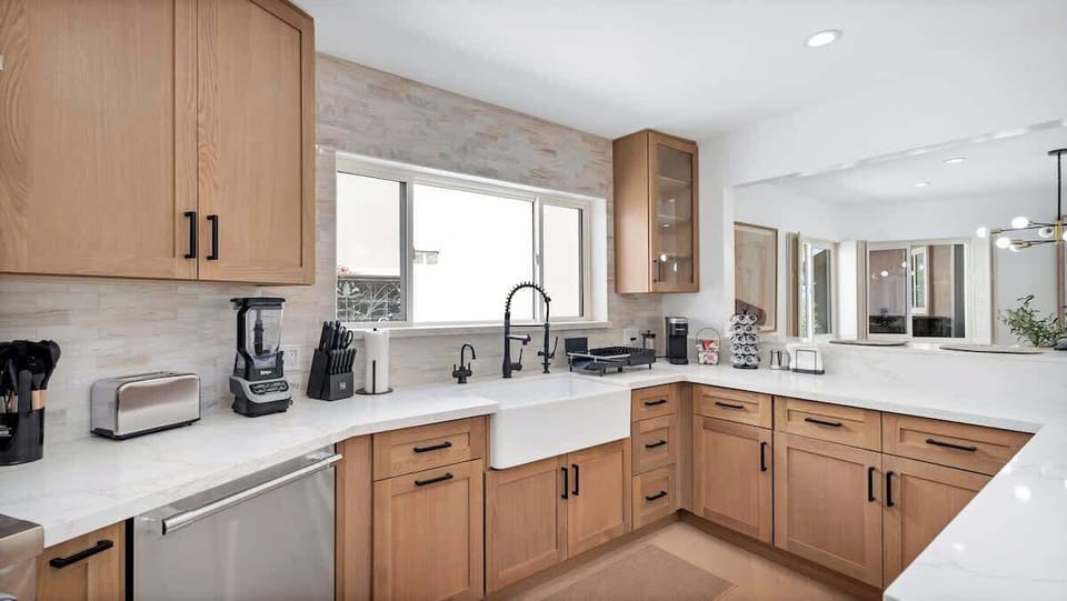 The beautiful kitchen comes fully stocked with a brand-new fridge, oven, microwave & dishwasher—plus Keurig, drip + French press, toaster, blender & popcorn maker. Includes pots, pans, dishes, utensils and everything you need to cook at home.