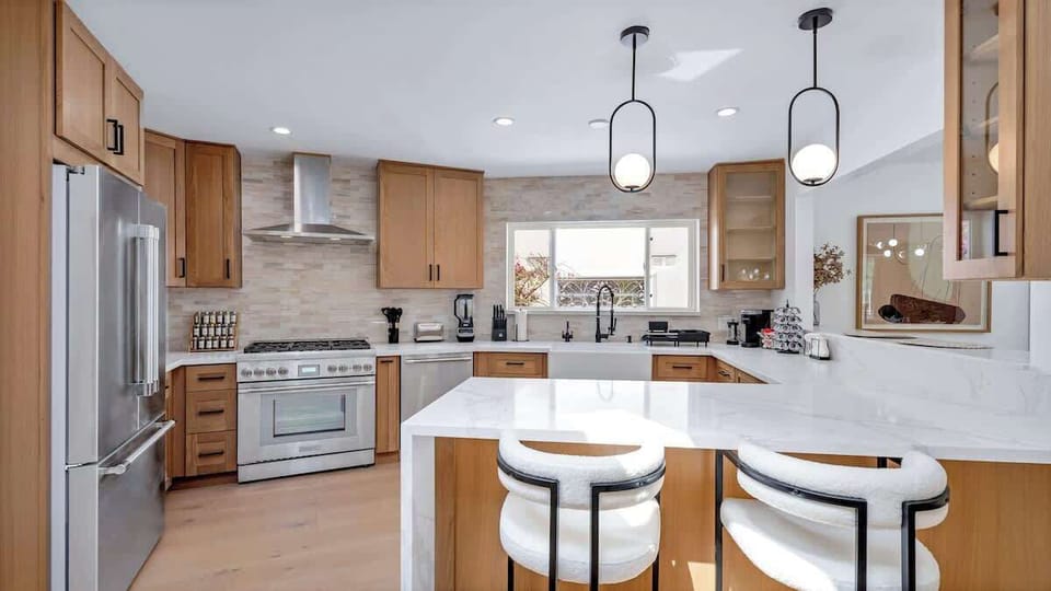 The beautiful kitchen comes fully stocked with a brand-new fridge, oven, microwave & dishwasher—plus Keurig, drip + French press, toaster, blender & popcorn maker. Includes pots, pans, dishes, utensils and everything you need to cook at home.