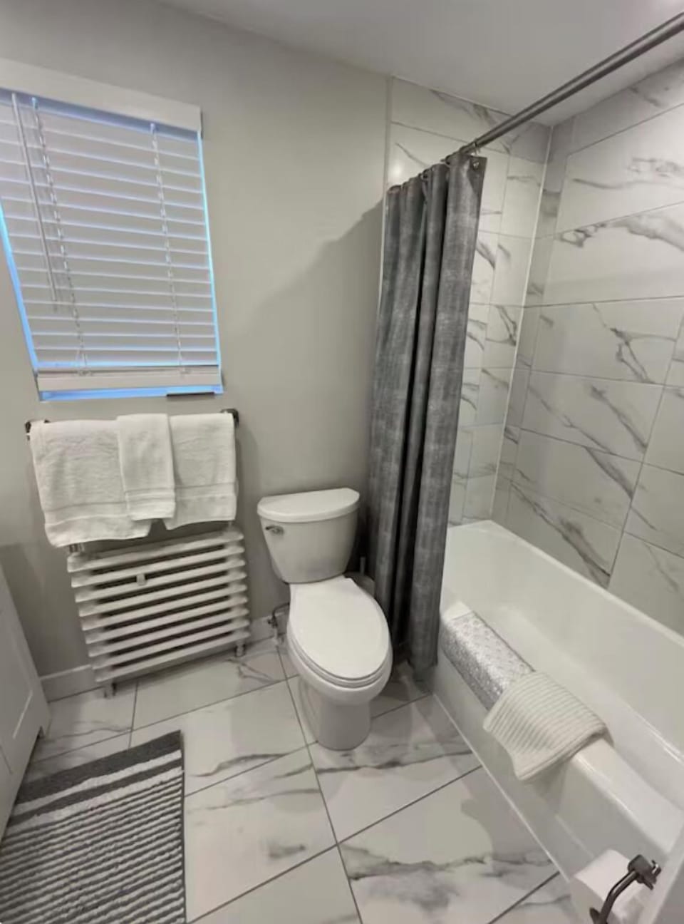 Full bathroom with bathtub/shower.