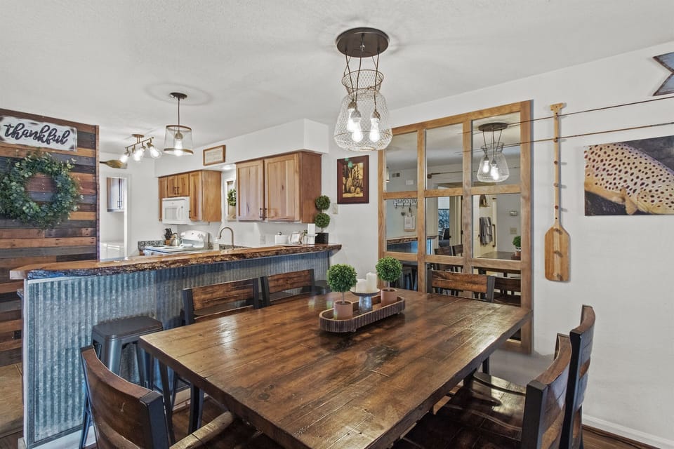 Dining area with seating for six at table and four at bar