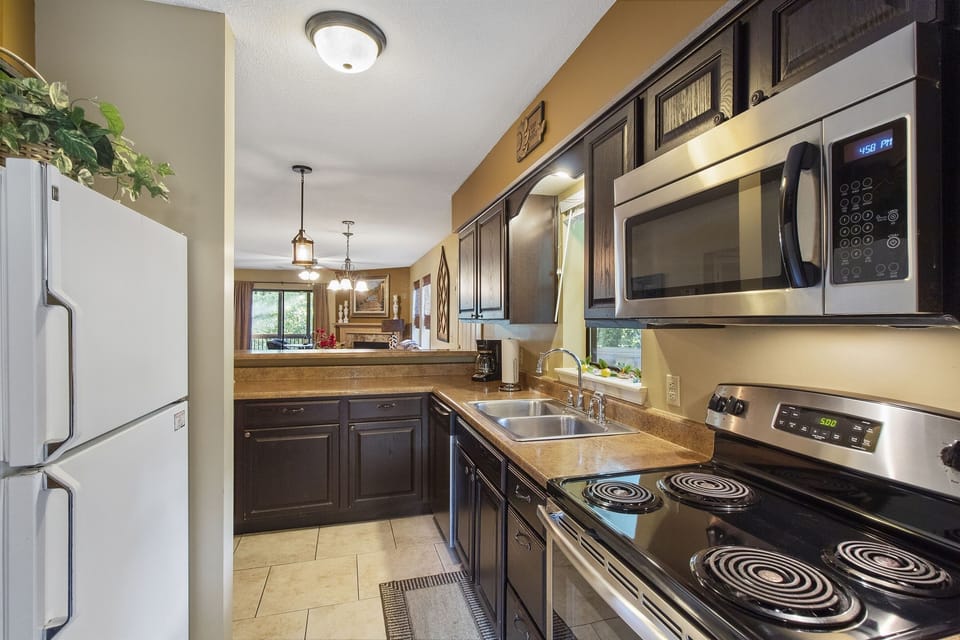 The kitchen is open to the dining area and living room.