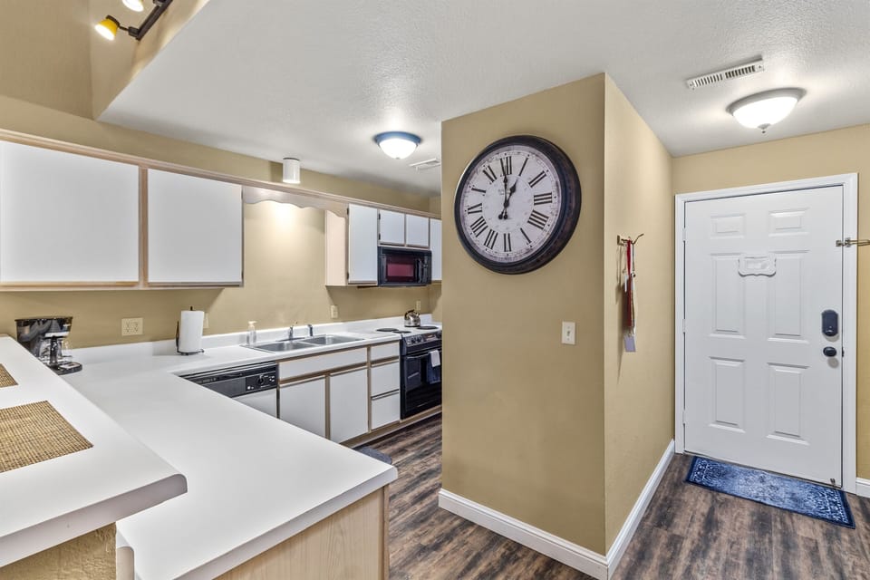 Full-Size Private Kitchen, stocked with dishes & appliances just off entryway