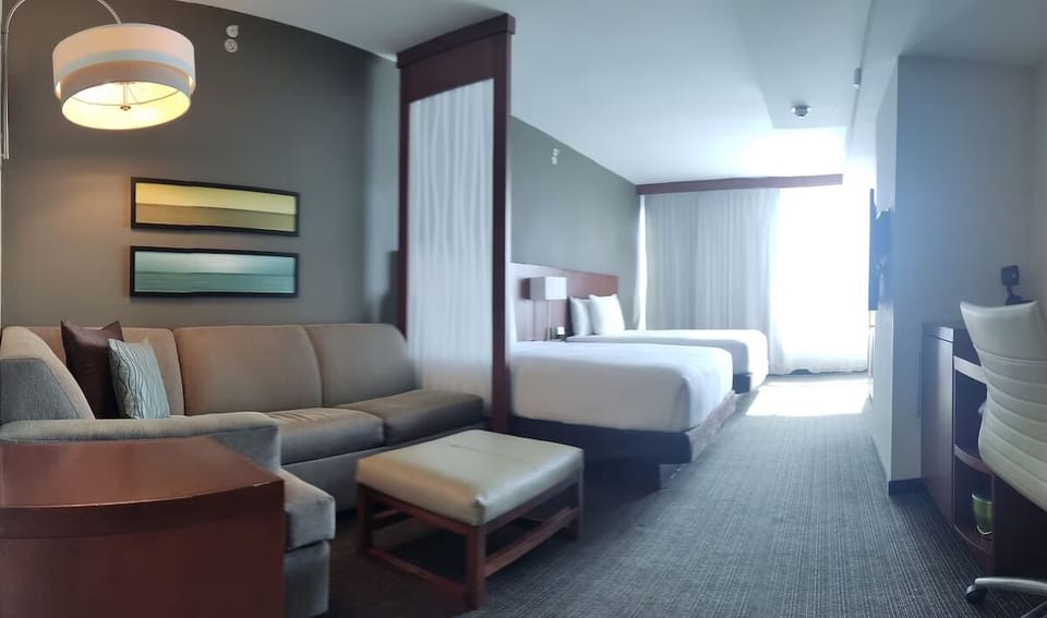 Stretch out in a spacious suite with cozy lounge seating.