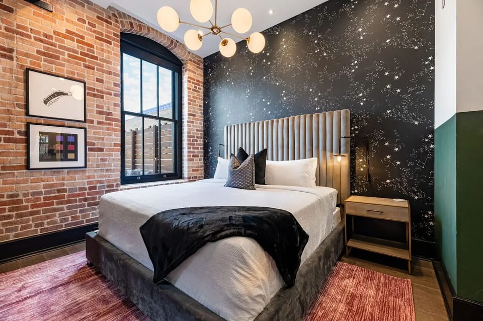 Retreat to the Primary bedroom with a plush king bed, walk-in closet, blackout shades, and a smart TV. Designed for comfort and privacy, this suite is perfect for recharging after a day exploring New Orleans.