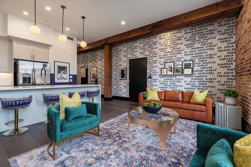 Relax in the living area with a smart TV, stylish seating, and a sleeper sofa for extra guests. Perfect for families or group stays in New Orleans, this inviting space is ideal for movie nights or recharging after a day in the city.