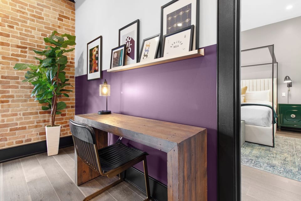 A cozy living room that blends comfort and productivity with a sleek workspace.