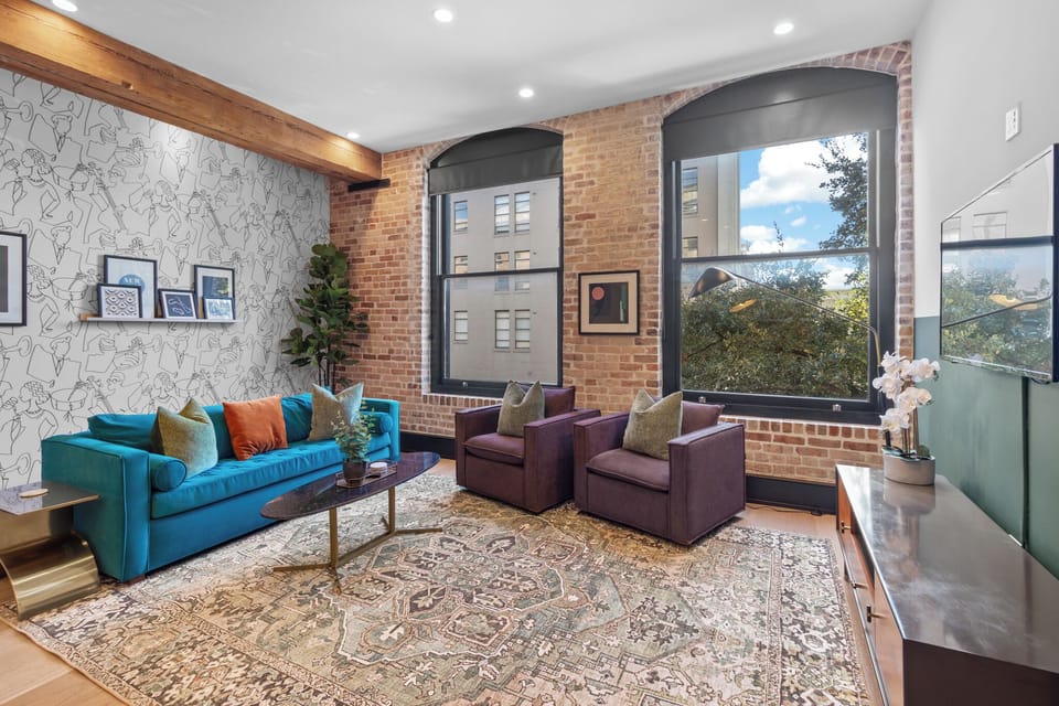 Relax in the living area with a smart TV, stylish seating and a sleeper sofa for extra guests. Perfect for families or group stays in New Orleans, this inviting space is ideal for movie nights or recharging after a day in the city.
