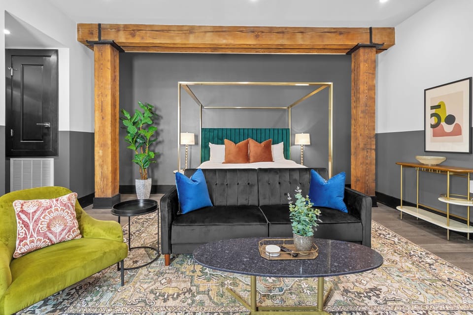 Relax in the living area with a smart TV, stylish seating, and a sleeper sofa for extra guests. Perfect for families or group stays in New Orleans, this inviting space is ideal for movie nights or recharging after a day in the city.