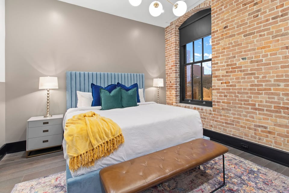 Retreat to the primary bedroom with a plush king bed, walk-in closet, blackout shades, and a smart TV. Designed for comfort and privacy, this suite is perfect for recharging after a day exploring New Orleans.