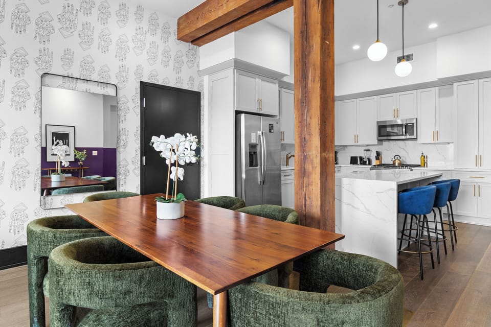 Relax in the living area with a smart TV, stylish seating, and a sleeper sofa for extra guests. Perfect for families or group stays in New Orleans, this inviting space is ideal for movie nights or recharging after a day in the city.